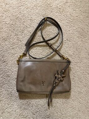 Frye taupe leather crossbody bag antiqued hardware and a decorative tassel